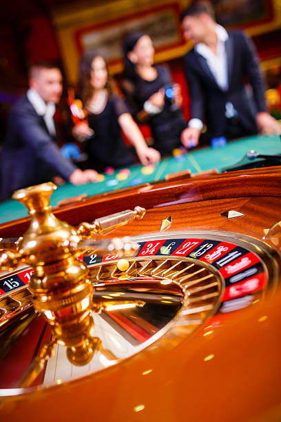 Mobile phone showing live baccarat table interface with betting controls and chat
